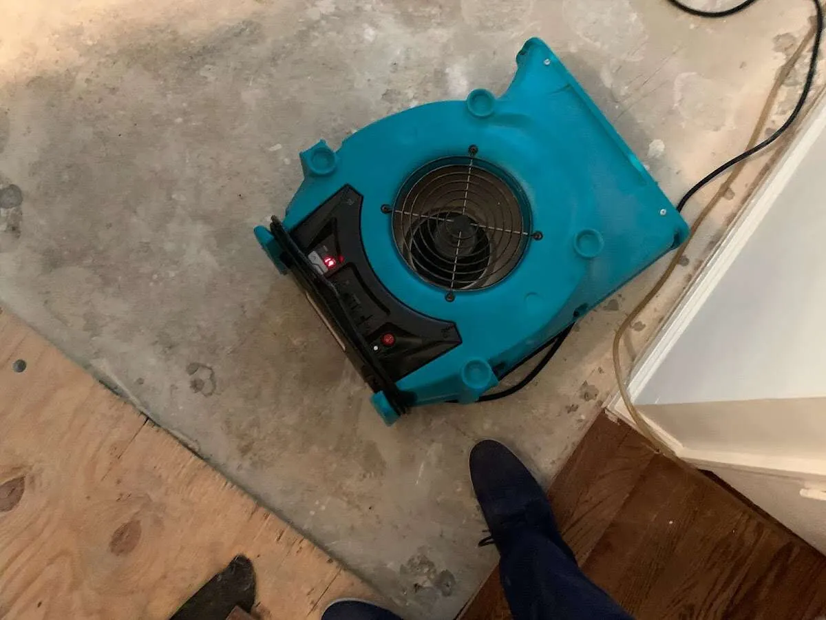 Air mover drying subfloor during Leak Detection & Repair in Springettsbury